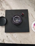 Lens Board Plate W/ Beslar No. 15107 F =75MM 1:3.5. Fixed Price $69.27.