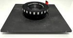 Rodenstock Omegaron 1:4,5 F=75MM Enlarging Lens Board. Fixed Price $80.00.