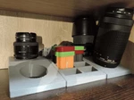 Nikon Storage Secure & Compact Solution For Camera Lenses. Fixed Price $21.00.