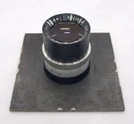 Soligor 135MM F4.5 Enlarger Lens On 8CM Metal Mounting Plate. Fixed Price $49.00.