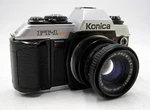Konica FT-1 Motor Film Camera W/ Beseler F2.8, 50MM Lens For Enlarger. Fixed Price $49.95.