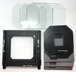 Set Used Durst Femoneg L1200 4X5 Negative Carrier With Inserts. Excellent. Fixed Price $600.00.